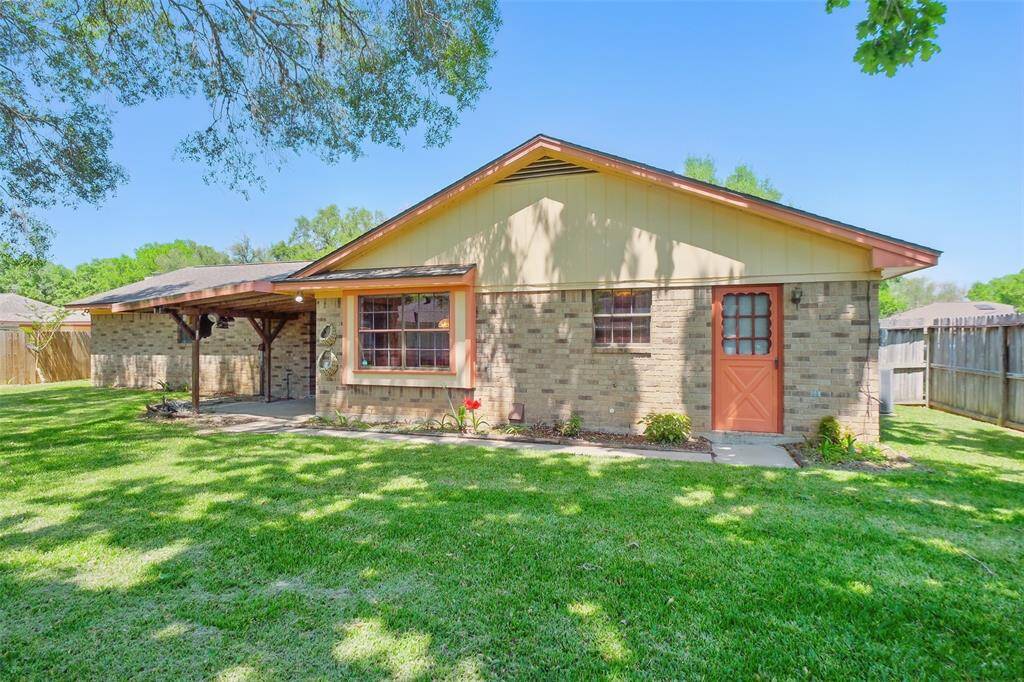 Backyard Scene #2. The red door at right center opens to the Utility Room. The Covered Patio is seen at left center in this picture.