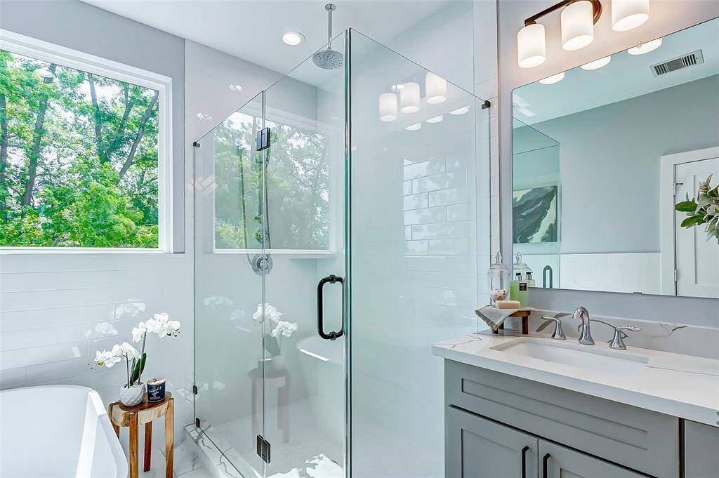 Notice the decorative tile wall featuring a beautiful herringbone design.