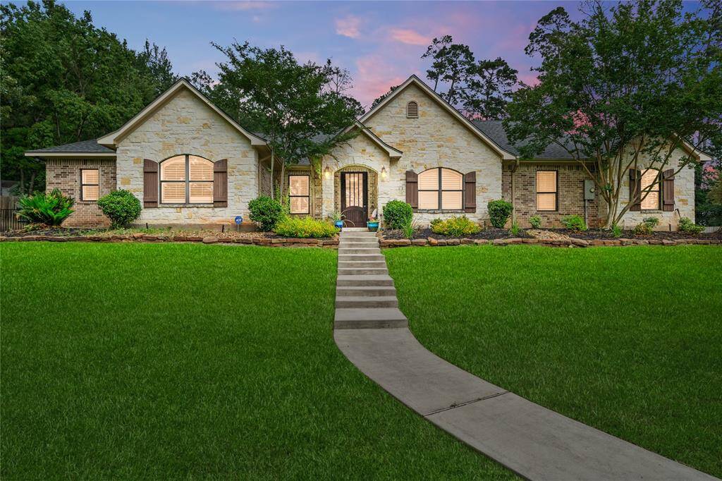 Sitting high on a hill and in the middle of the 1.5 acre lot, this gorgeous home invites you in with a smile and a hug!