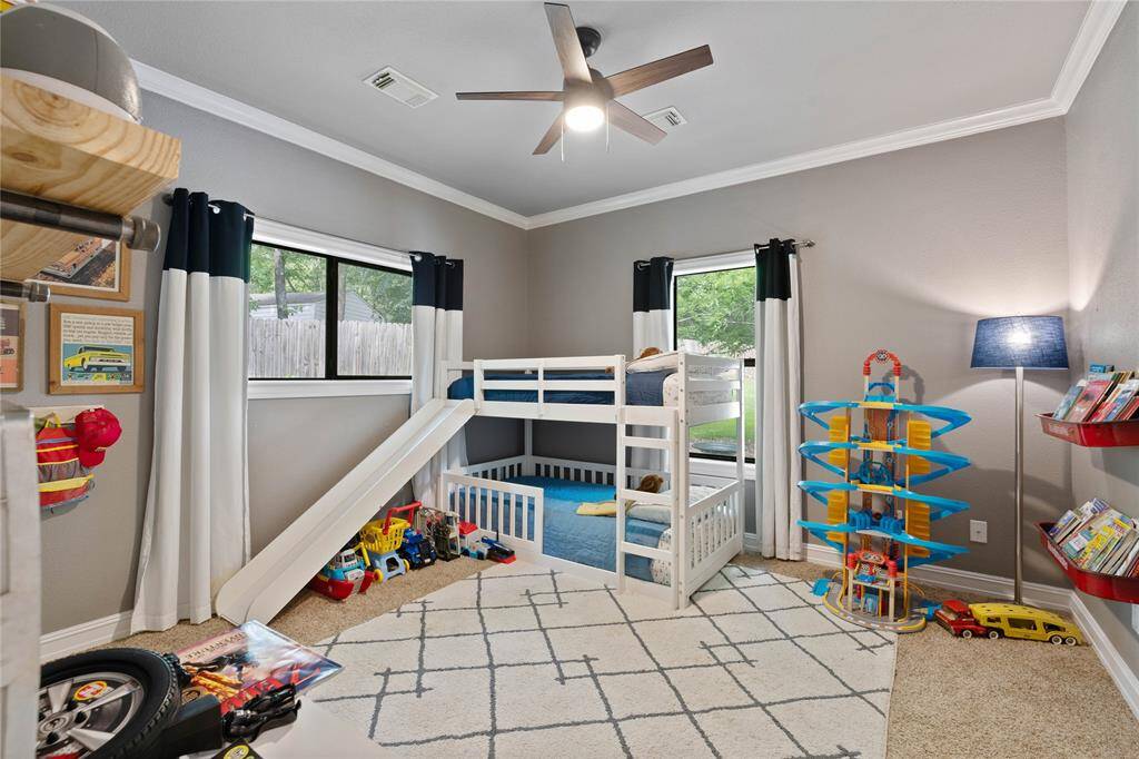Third bedroom that overlooks the backyard. This room has its own full bathroom also accessible for guests.