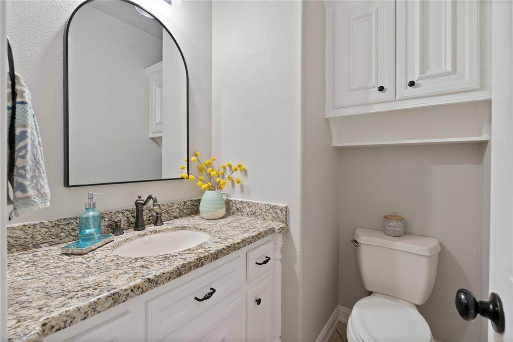 Half bath located near laundry room and good for pool guests and use.