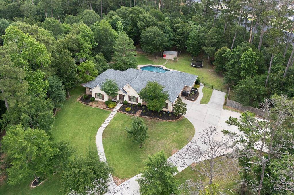 Gorgeous aerial view of the partially wooded 1.5 acre lot.