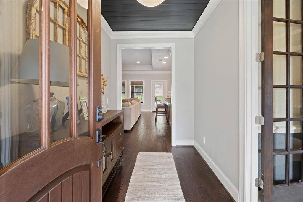 Front entry welcoming you into the main living space and dining to the right.