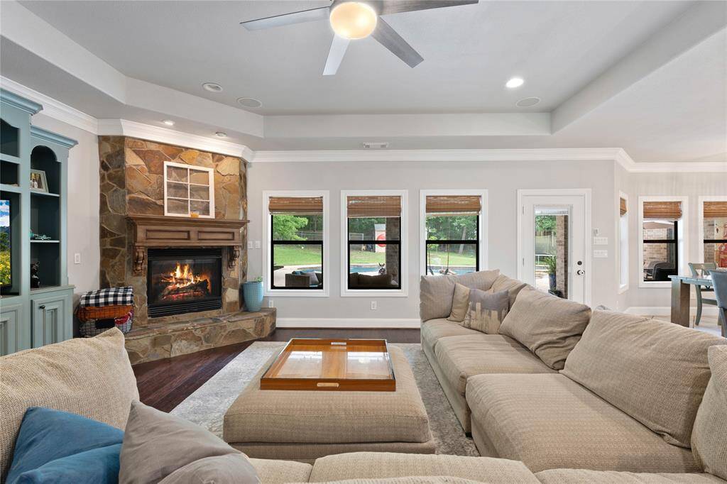 Talk about cozy! Family room with gas fire place overlooking the gorgeous yard.