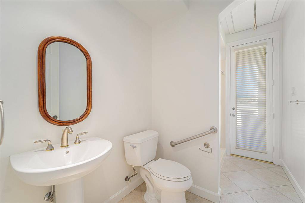 Full bath coming in from the patio/pool area for easy access