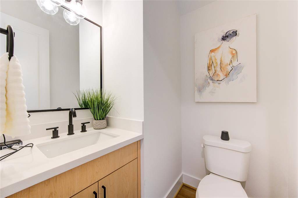 Downstairs 1/2 Bath with full vanity (extra storage).