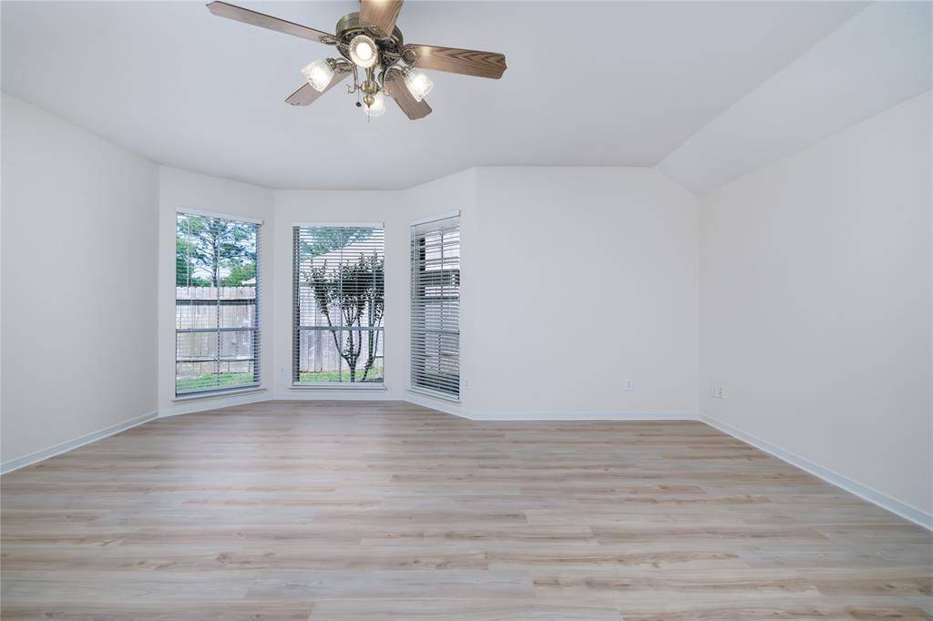 Primary bedroom with view of backyard.
