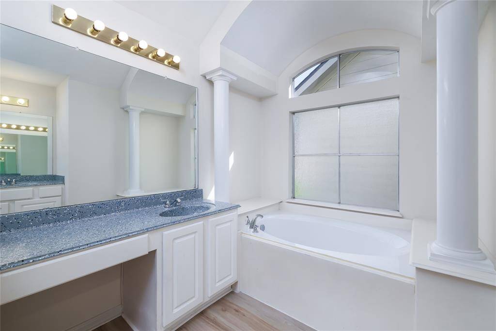 The elegant rimary bath also has a garden style tub and privacy window.