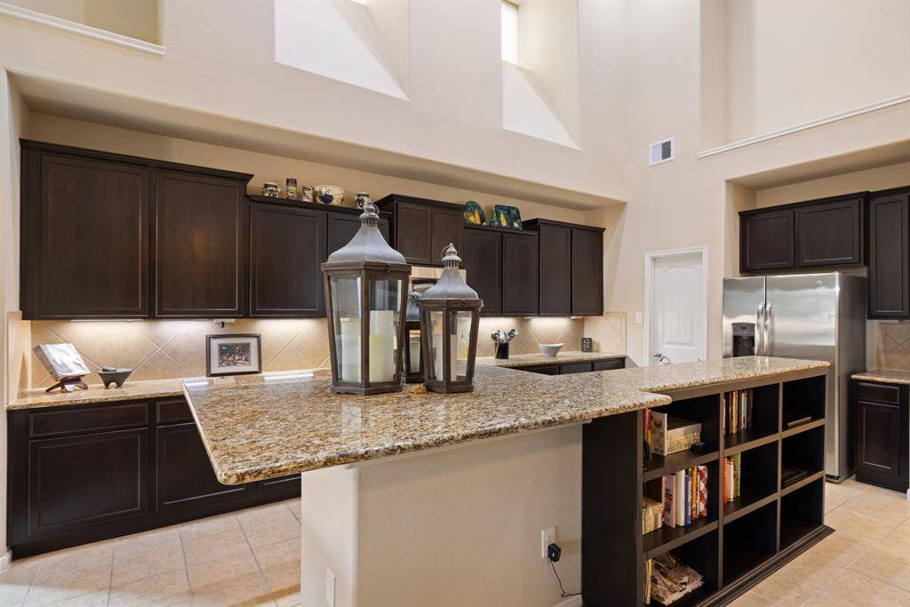 The kitchen design is sure to impress. Imagine the meals you can create in this space featuring GAS cooking, LED lighting, stainless steel appliances, and a spacious pantry.