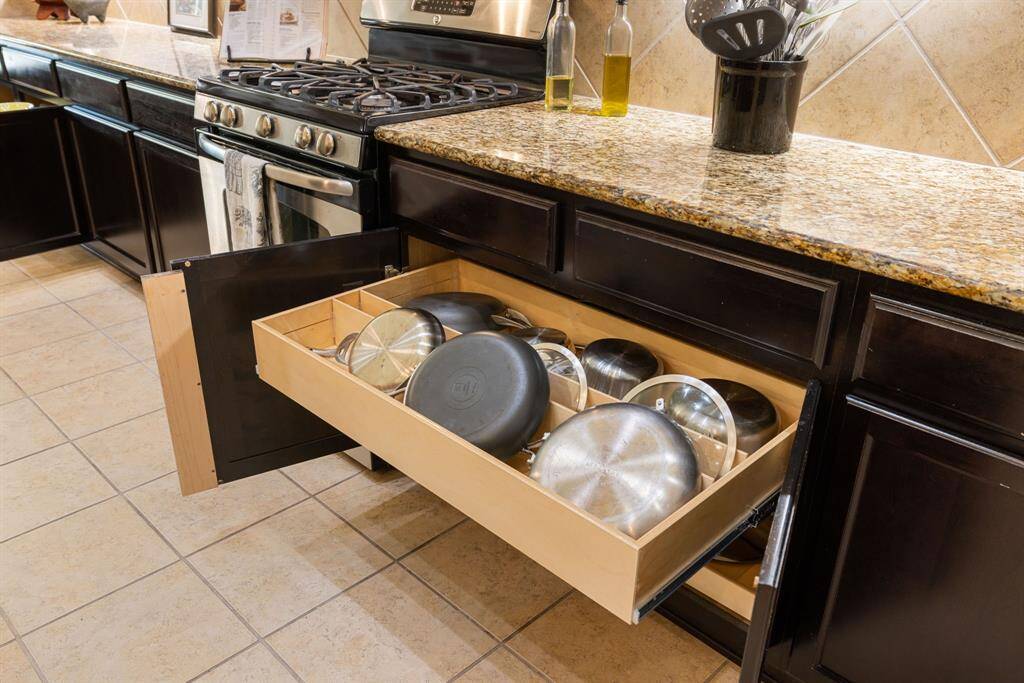 Now featuring Shelf Genie glide-outs throughout the lower cabinetry for effortless organization and accessibility. Installed in 2021.