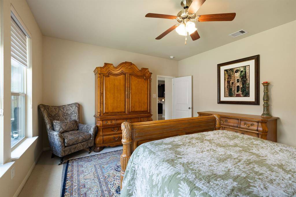 Primary bedroom is located on the back of the home.