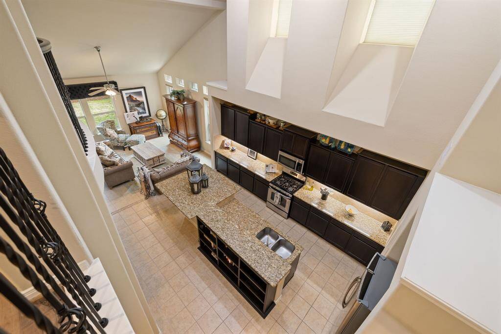 Discover the abundant space this home has to offer, with additional bookshelves thoughtfully integrated under the kitchen counter. This clever addition not only maximizes storage but also adds a touch of charm and functionality to the heart of the home.