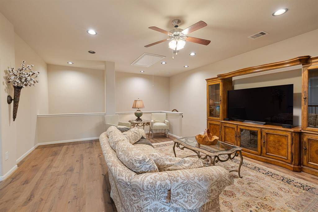 Here's another perspective of this expansive game room ad or flex space, showcasing its generous layout and the versatility it offers for entertainment and relaxation. The room's open layout provides ample space for various activities and furnishings.