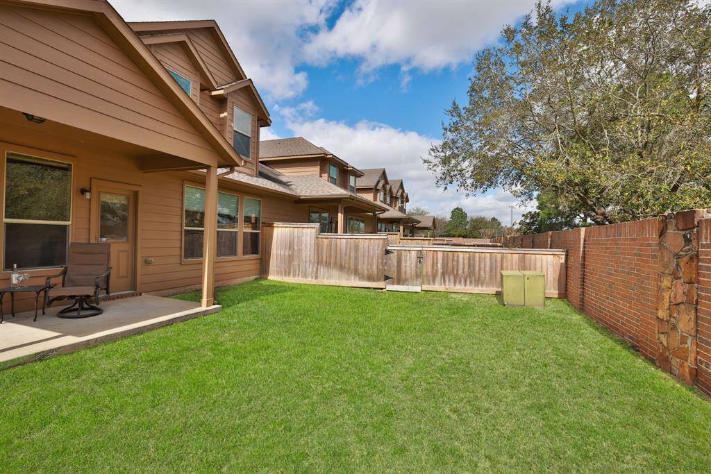 The fenced outdoor area provides a safe and enjoyable environment for the entire family to enjoy.
