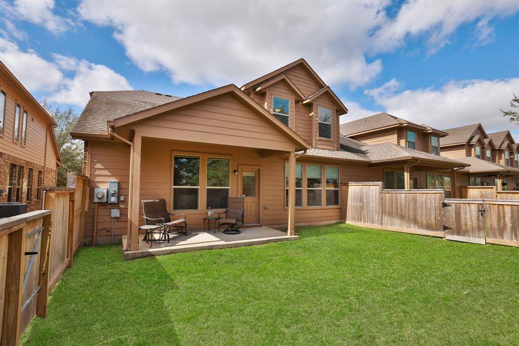 Here's another view of the spacious backyard, highlighting its layout and potential for outdoor activities. This generous space is ideal for hosting gatherings, or simply relaxing in a serene setting.