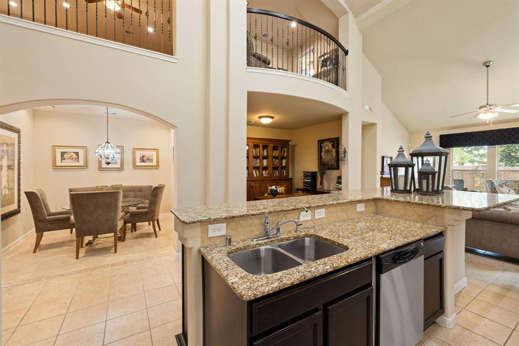 The heart of this home is a chef's dream, featuring ample storage solutions and abundant counter space. The kitchen's thoughtful design provides seamless flow to the formal dining, study and living areas making meal preparation and hosting an absolute pleasure!