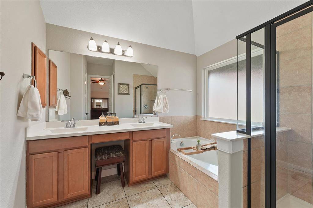 The master ensuite bath features double sinks with a spacious vanity area, providing plenty of room for both function and style.
