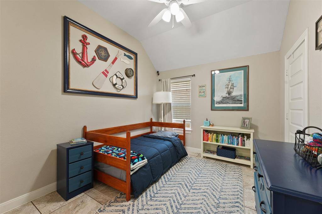 This secondary bedroom offers a spacious and versatile layout, perfect for a guest room, home gym, or kid’s retreat. It’s a peaceful and comfortable space with plenty of natural light and room to grow.