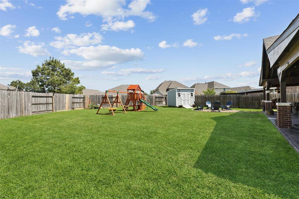 With ample space, you can easily imagine a pool as the perfect addition to this expansive outdoor oasis.
