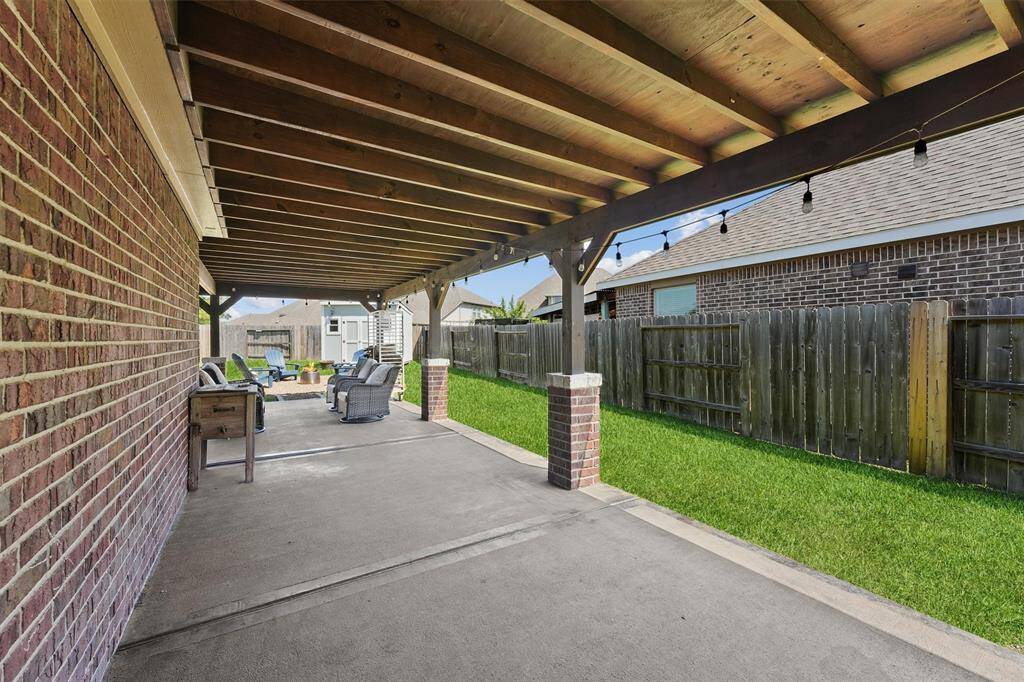 Plus, the side patio provides even more room to enjoy the outdoors, making it a fantastic space to relax or host guests.