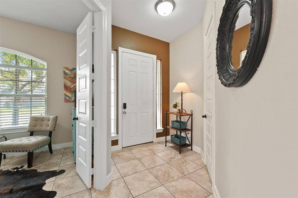 Featuring tile floors throughout, this home offers a clean, cohesive aesthetic and low-maintenance living.