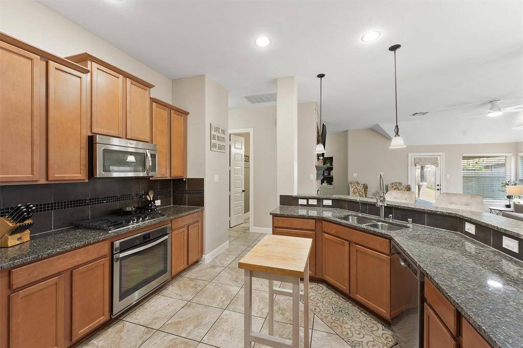 Truly the heart of the home, the kitchen boasts ample storage space, making it both functional and inviting. It’s the perfect place to prepare meals and gather with family and friends.