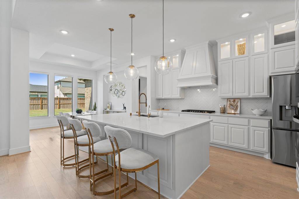 This chef's style kitchen has an abundance of cabinets and countertop space!