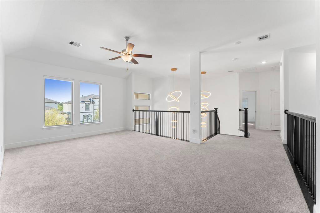 This spacious game room is versatile and could be used in a variety of ways!