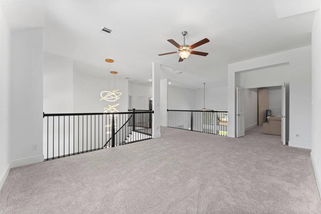 The game room flows seamlessly into the private and oversized media room!