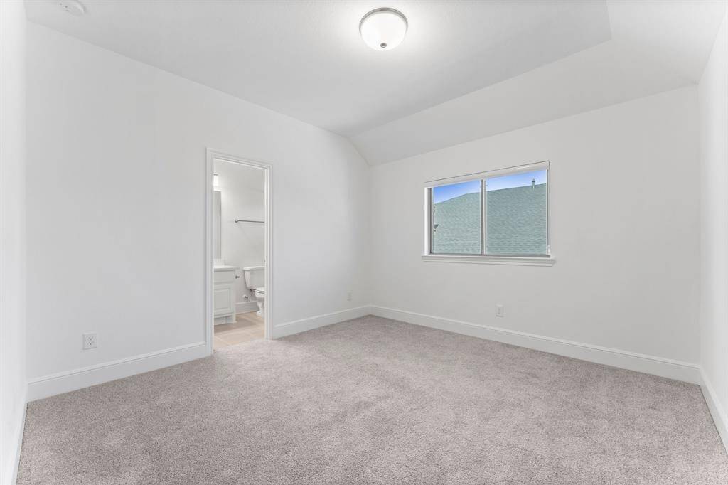Fresh, bright, and beautiful—this secondary bedroom features an ensuite bathroom and oversized windows!