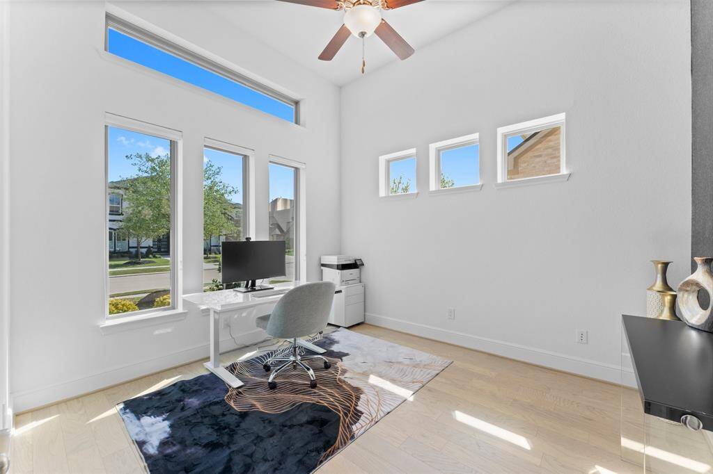 Work from home in style! This bright and airy study features high ceilings plus many gorgeous oversized windows that let in a lot of natural light!