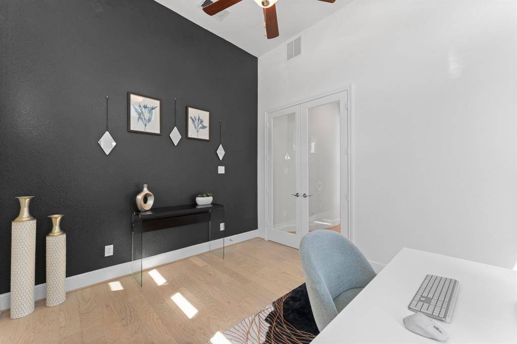 Sophisticated and stylish—the glass double doors add privacy to the spacious study!