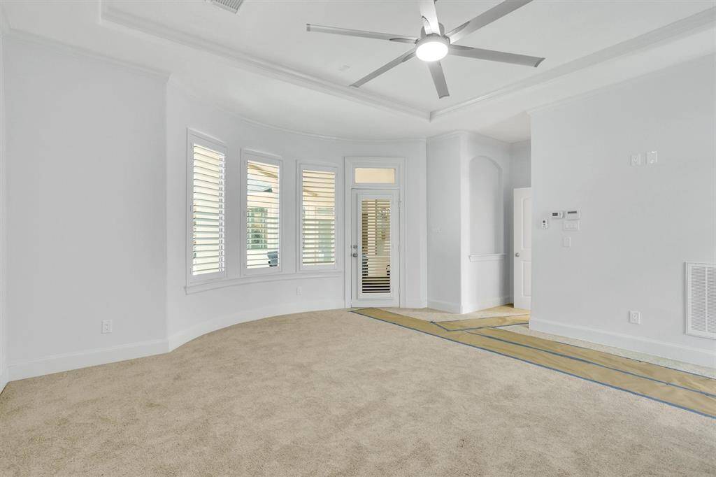 What a wonderful place to come home to, this stunning primary suite greets you with carpet floors, a warm neutral paint, trey ceiling, ceiling fan with lighting, lovely windows allowing in natural light brightening up this spacious primary bedroom, with extra space for a seating area. The master bedroom has a direct access to the backyard where it is so convenient to unwind on a sunny day!