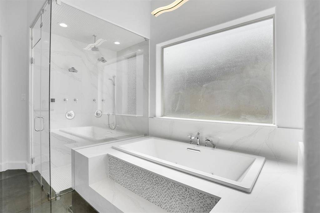 A separate garden tub for soaking after a long day and a walk-in shower.