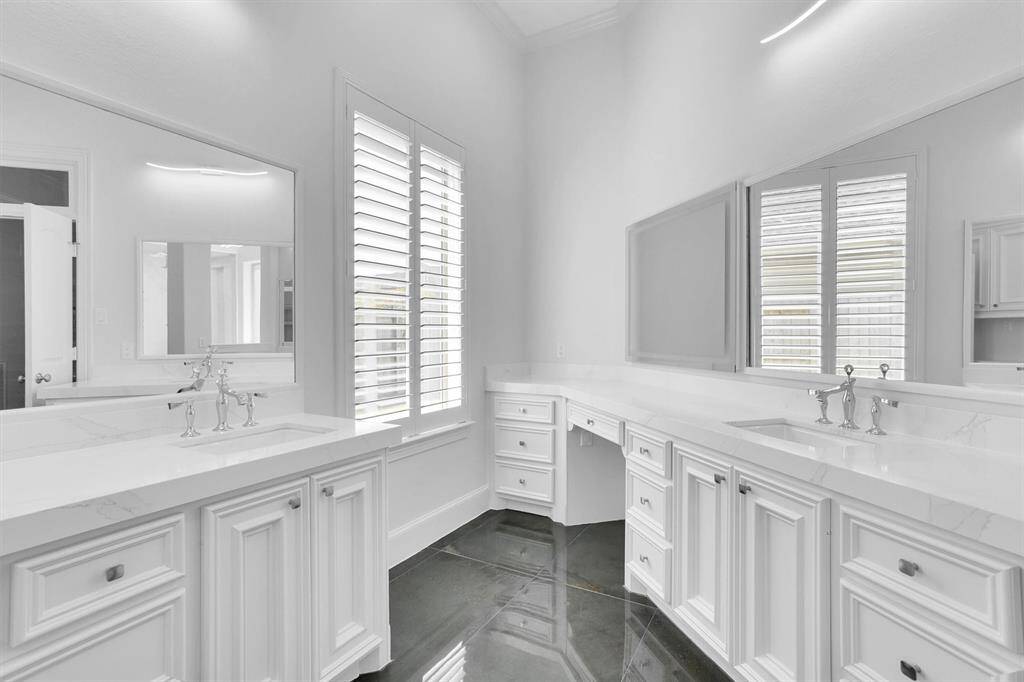 Huge vanities for his and hers plus plenty of storage for everyone to use.