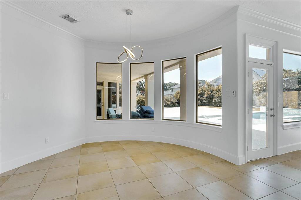 Start your day off right with a cup of coffee sitting with your family in the breakfast area! Featuring large windows, beautiful flooring, and access to the covered back patio with the pool!