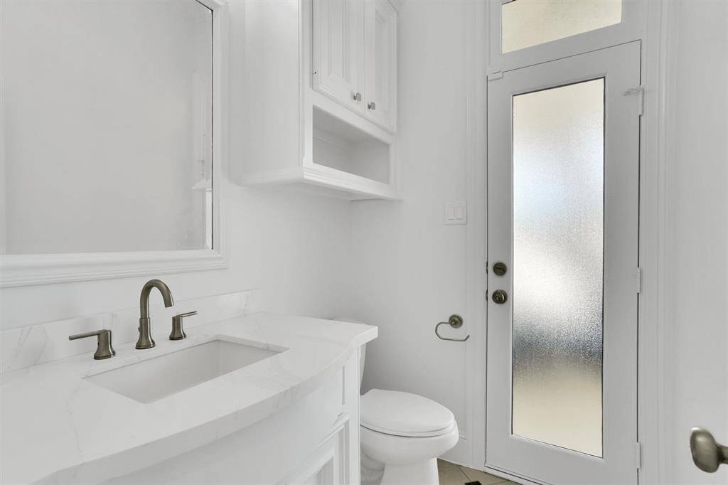 The secondary half bathroom is located in the first floor.