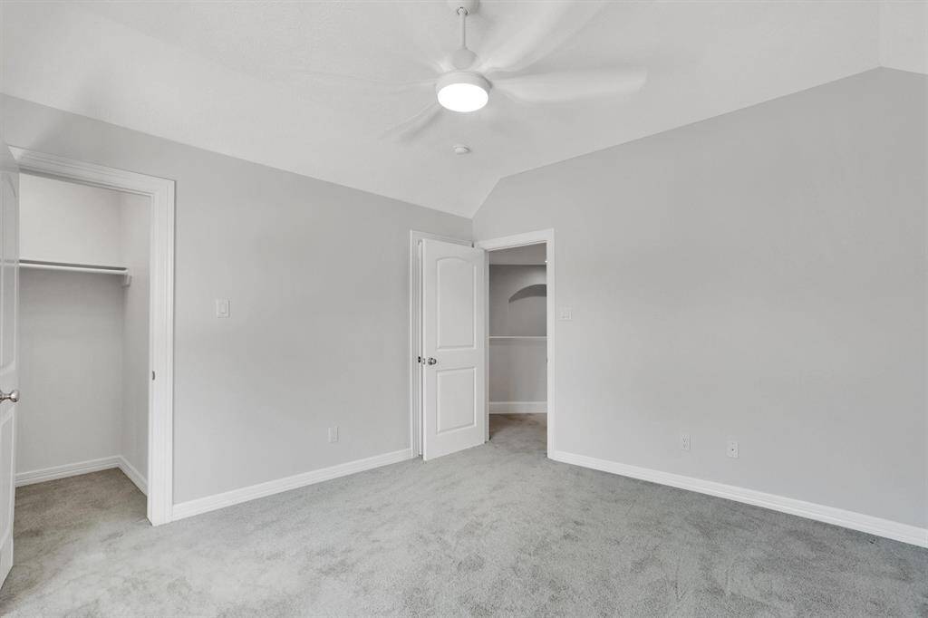 Another view of the secondary bedroom with walk-in closet.