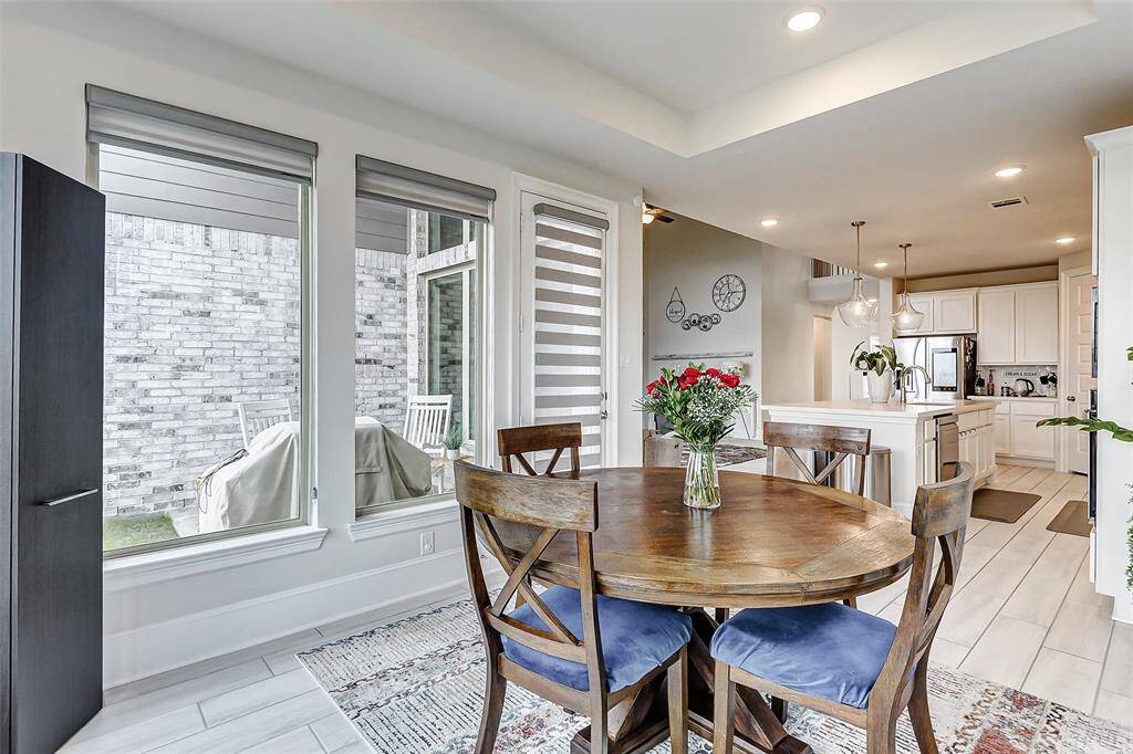 Open concept dining connecting key spaces such the kitchen, patio and living room.