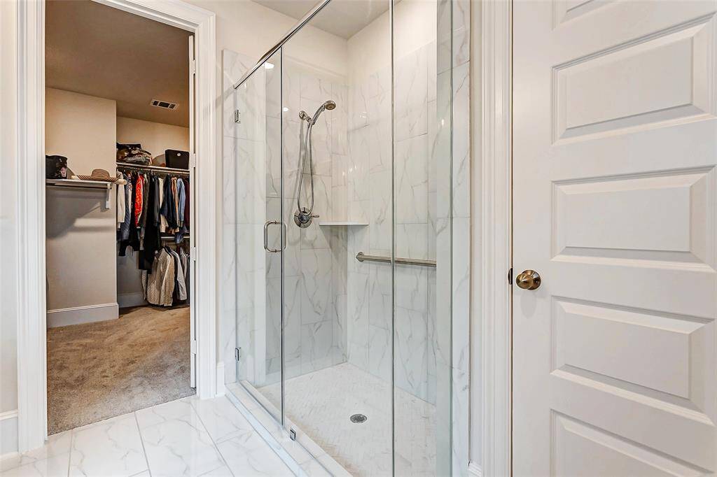Expansive shower with barrier free entry and accessible designs