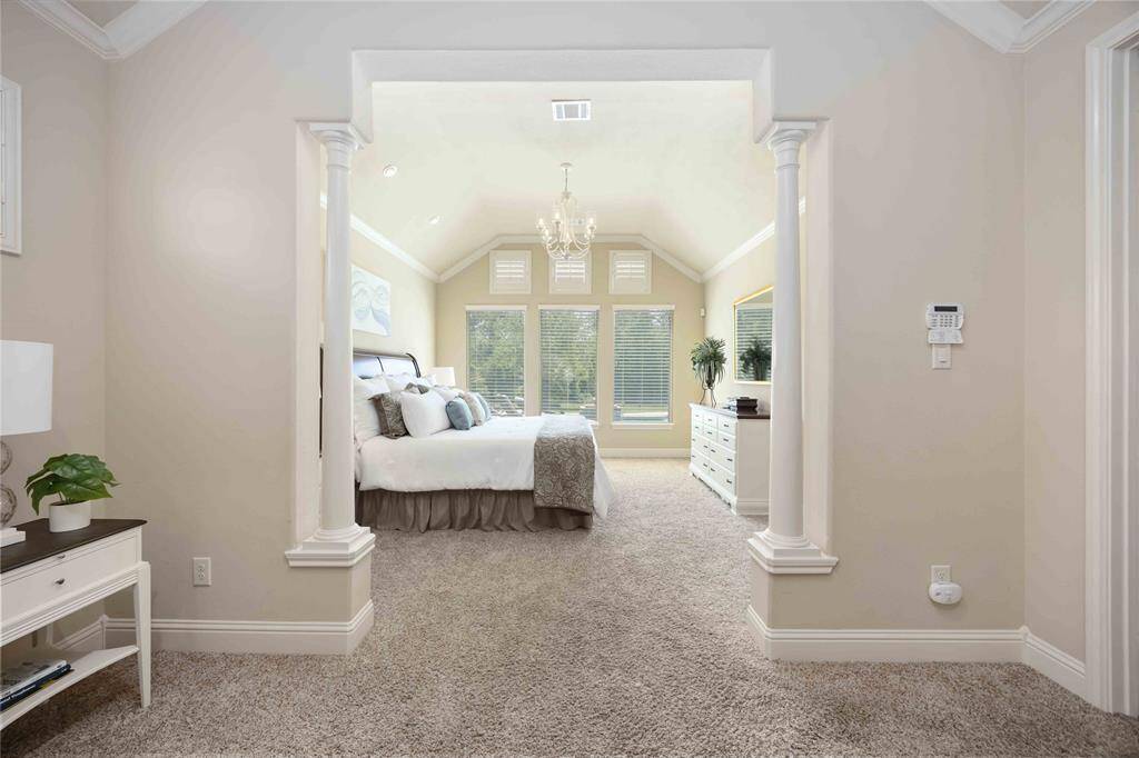 Welcome to a luxurious primary bedroom that serves as a perfect sanctuary.