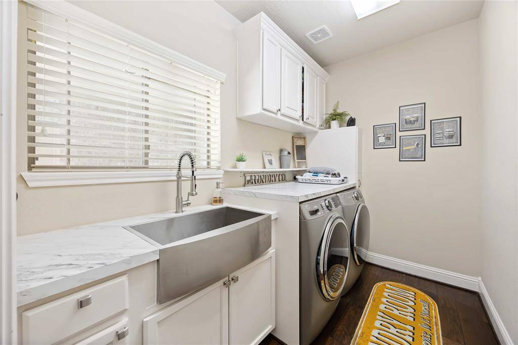 The laundry room is a harmonious blend of functionality and style, designed to make chores more enjoyable.
