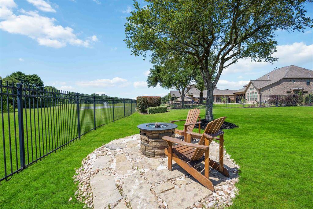 Firepit sitting area offering scenic views of the lakes on either side.