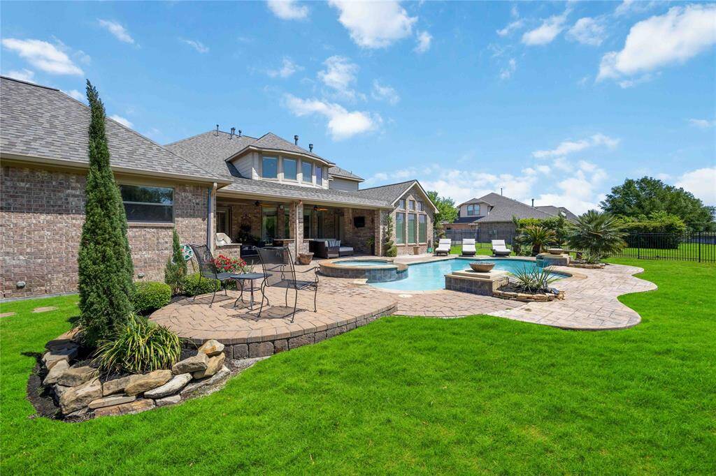 Backyard designed for entertaining, offering ample room for furniture and seating options.