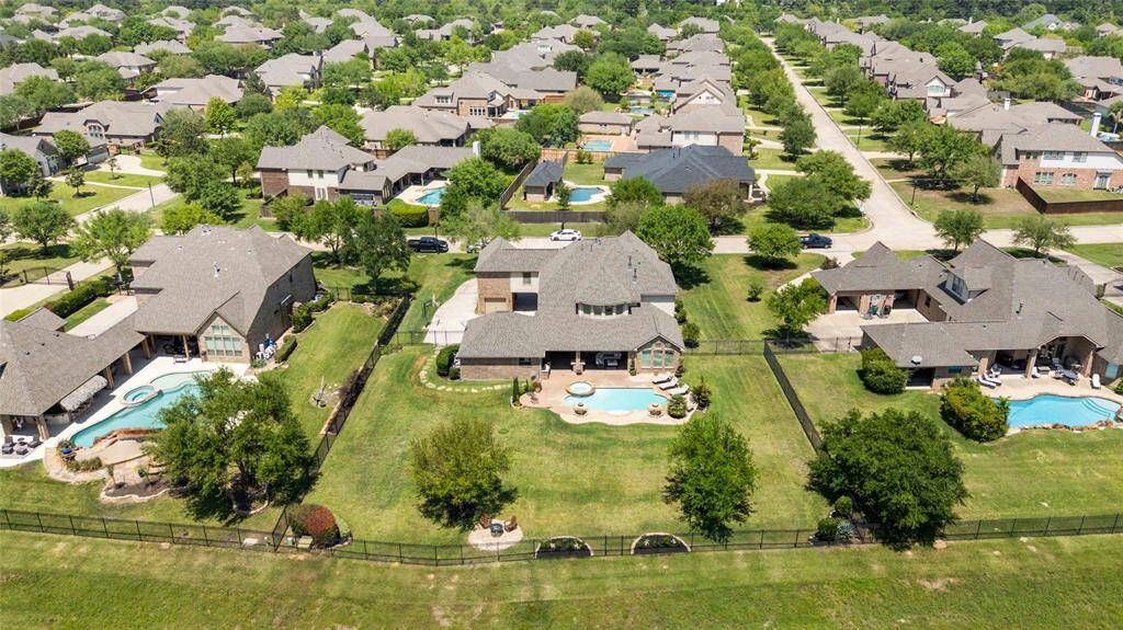 This perspective displays an aerial view of the house from the rear.
