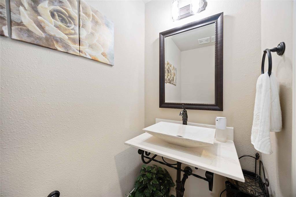 A chic powder room featuring a contemporary sink.