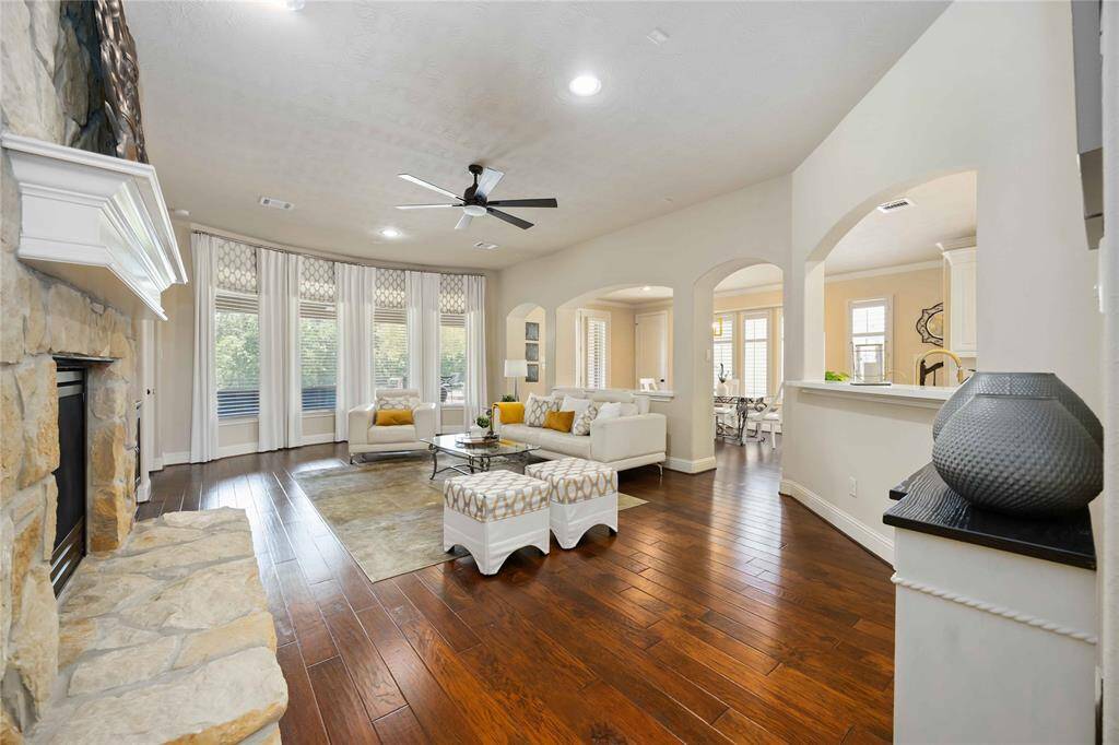 As you step into the family room, you're greeted by an open and airy atmosphere, enhanced by large windows that invite an abundance of natural light to flood the space.