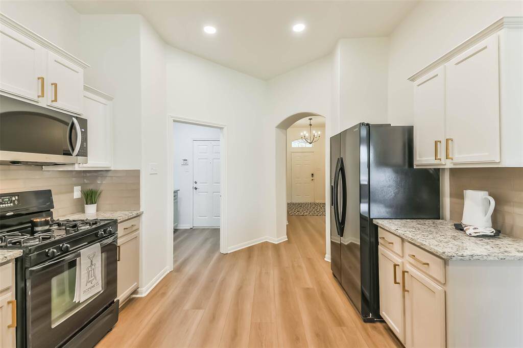 While preparing or tidying up, you can see the entryway, or into the living and dining space, which is a fantastic floor plan.