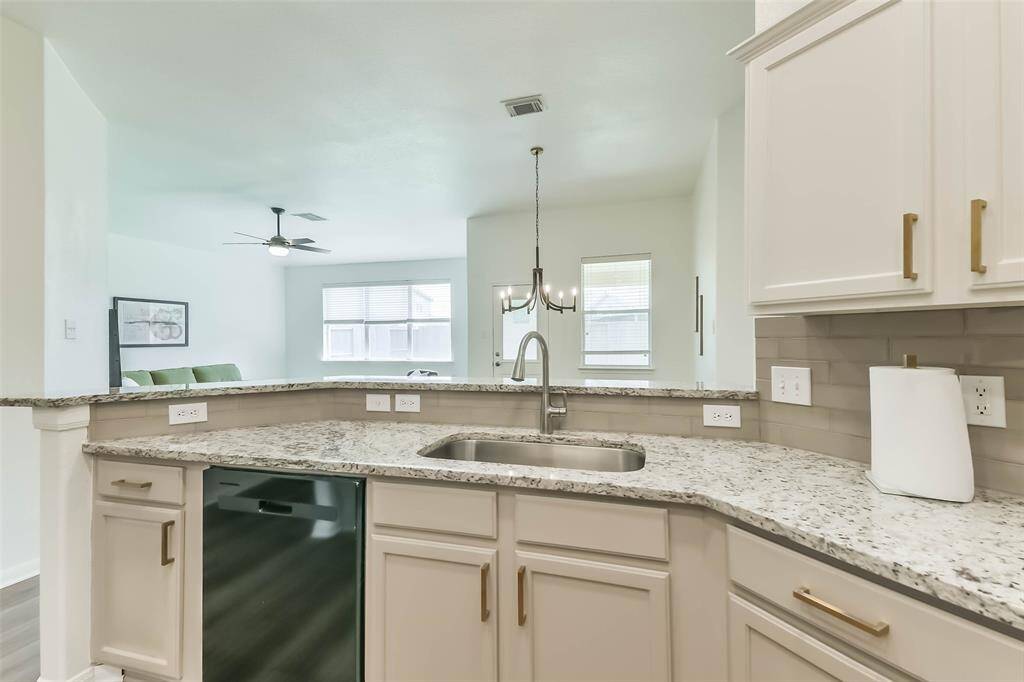 Experience seamless living with a spacious open floor plan connecting the kitchen, living, and dining areas.