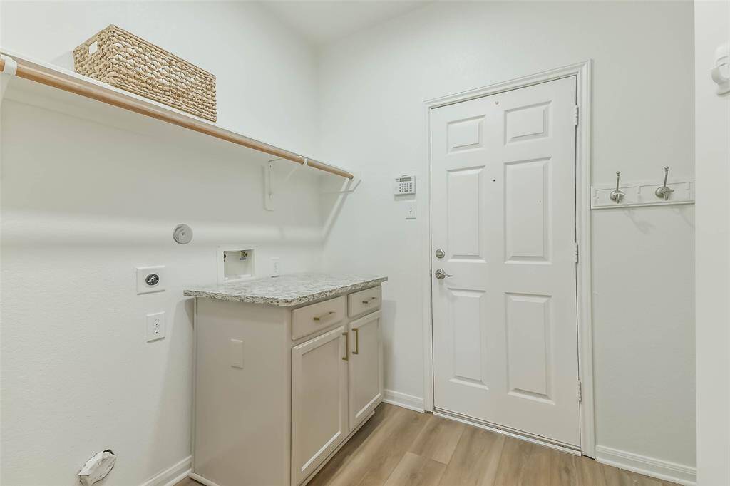 Experience versatility with a utility room featuring a movable island, perfect for the kitchen or any space you choose!